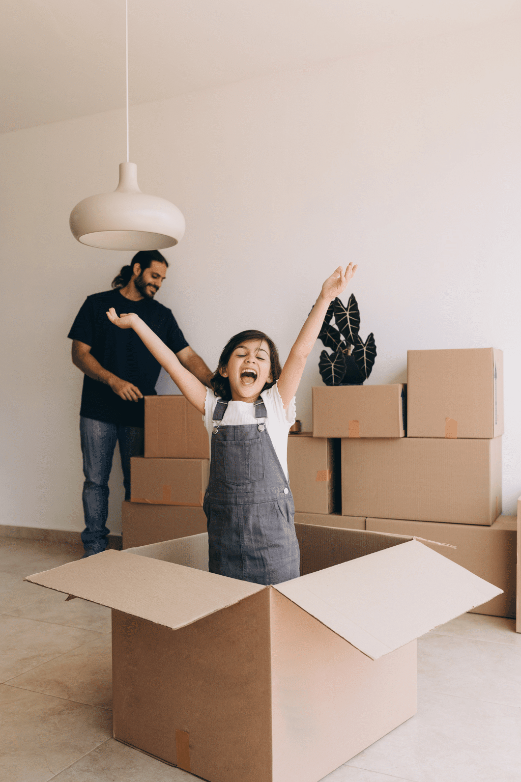 Family unpacking boxes and settling into a new home in Bronx NY